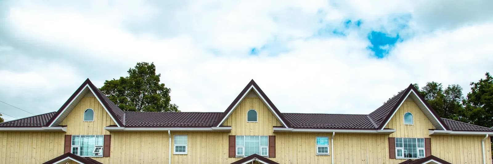 A metal roof on a home in winter light